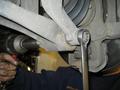 Undoing shock absorber lower mounting